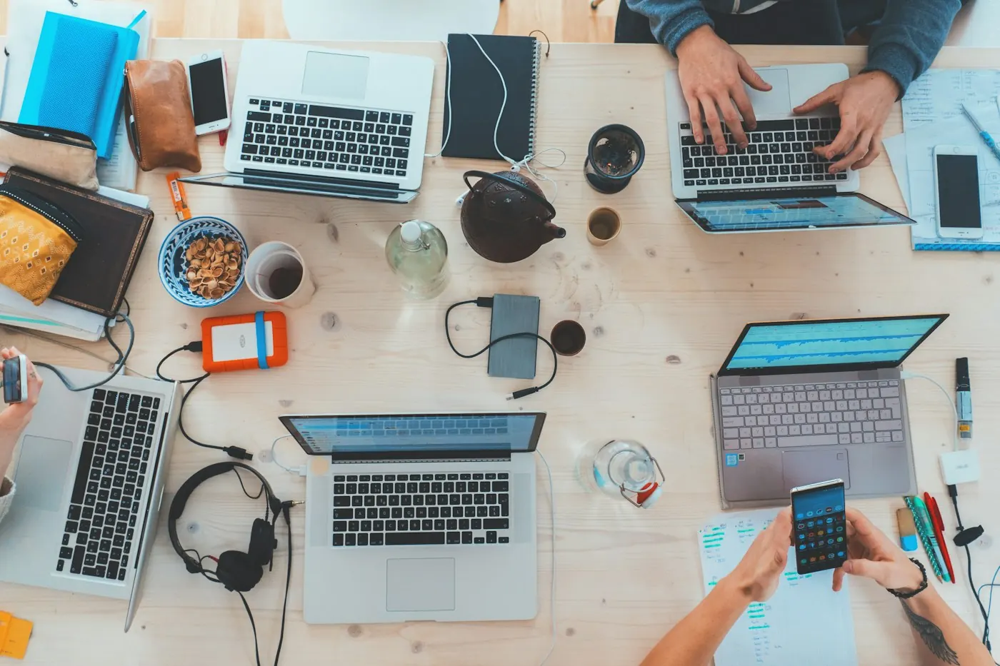 People working together with laptops and digital tools